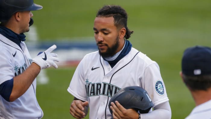 J.P. Crawford is congratulated after scoring